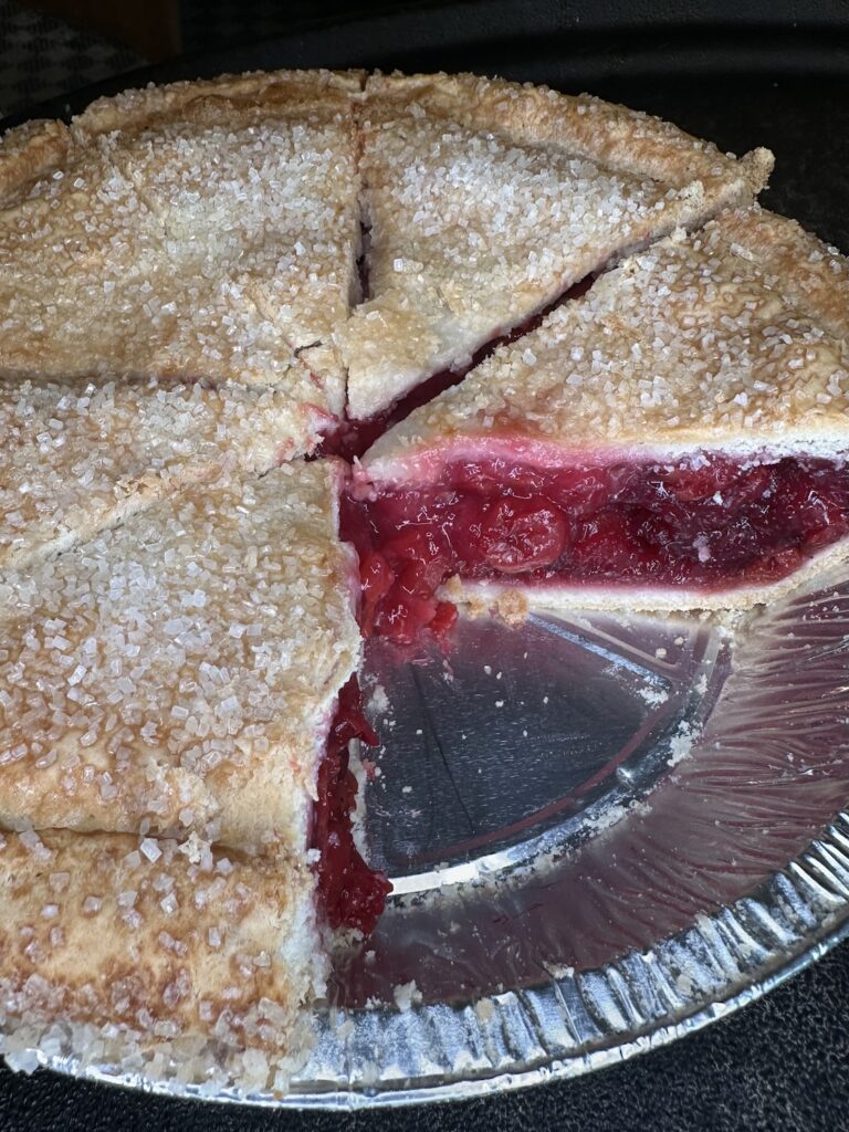 Machine Shed Cherry pie with a few slices missing